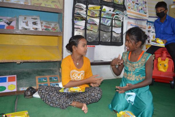 Children using sign language during a Focused Group Discussion.